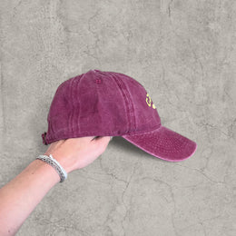 Vintage style baseball cap with yellow camel logo in burgundy