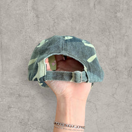 Vintage style baseball cap in khaki green camo print with pink gothic logo