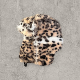 Russian Ushanka fluffy winter hat in cream beige leopard print with faux fur fluff. One size.
