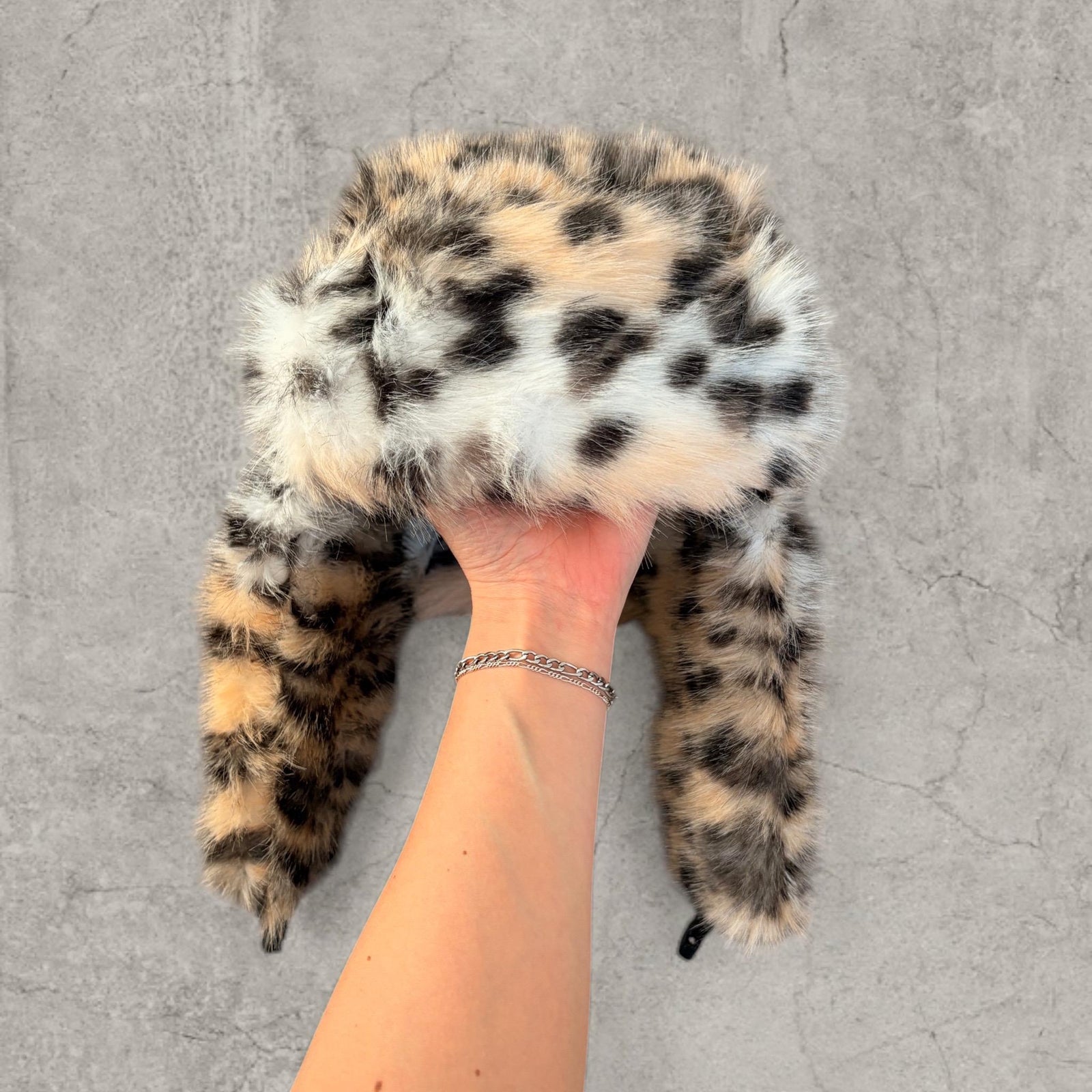 Russian Ushanka fluffy winter hat in cream beige leopard print with faux fur fluff. One size.