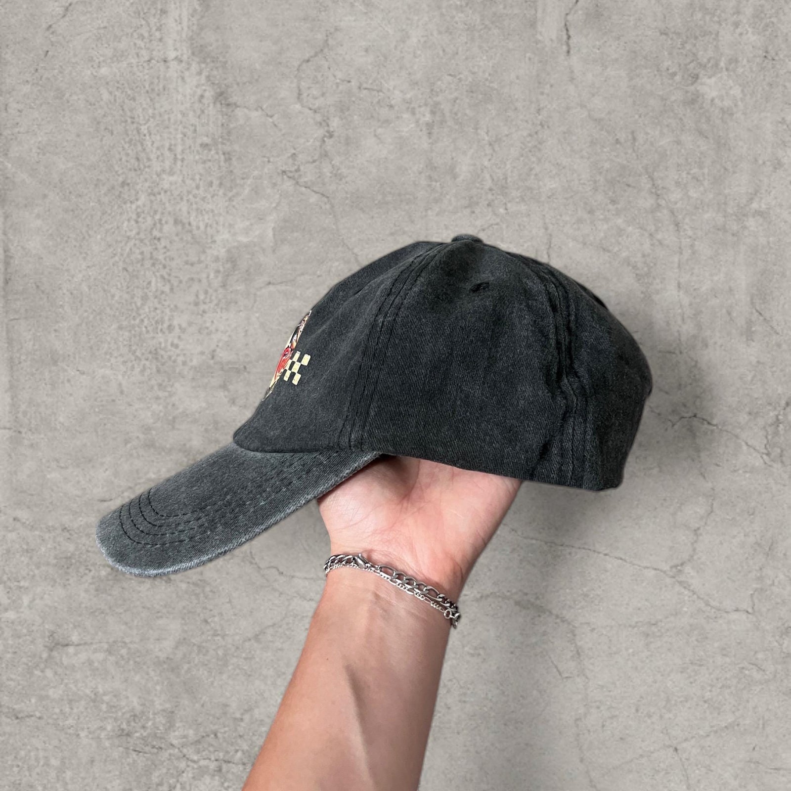 Vintage style baseball cap in black with red white castrol oil petrol logo.