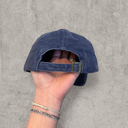 Vintage style baseball cap with yellow camel logo in navy blue