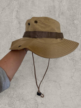 Vintage style Boonie jungle bucket hat with straps in beige. One size
