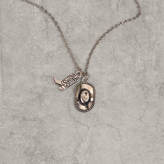 Silver colour stainless steel necklace with cowboy boot and hat pendants on a rope chain