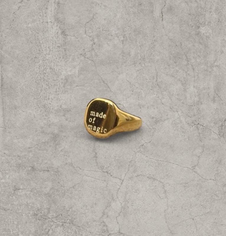 Cool vintage style gold colour stainless steel signet ring with made of magic engraving.