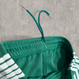 Insane baggy relaxed fit trousers in dark green with white stripes.
