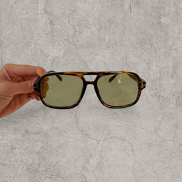 Vintage style aviator sunglasses with green tinted lenses in tortoise shell frame