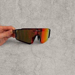 Insane sport sunglasses in black with red orange yellow reflective lenses. One size