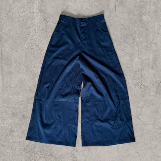 Black baggy wide-leg tailored trousers laid flat showing overall front view
