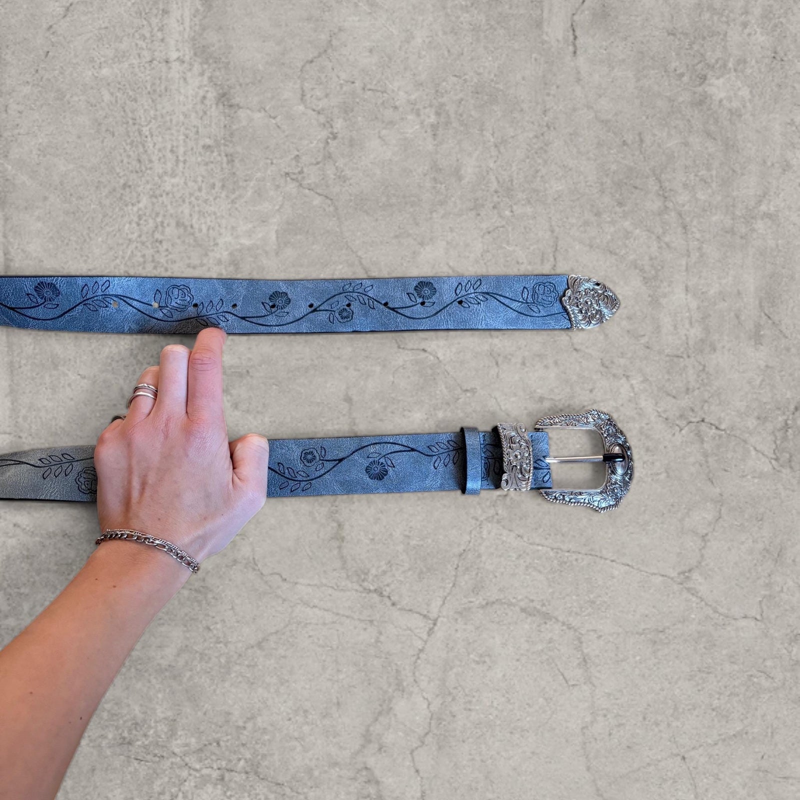 Vintage style faux leather western cowboy belt in grey with silver trim. 103cm.