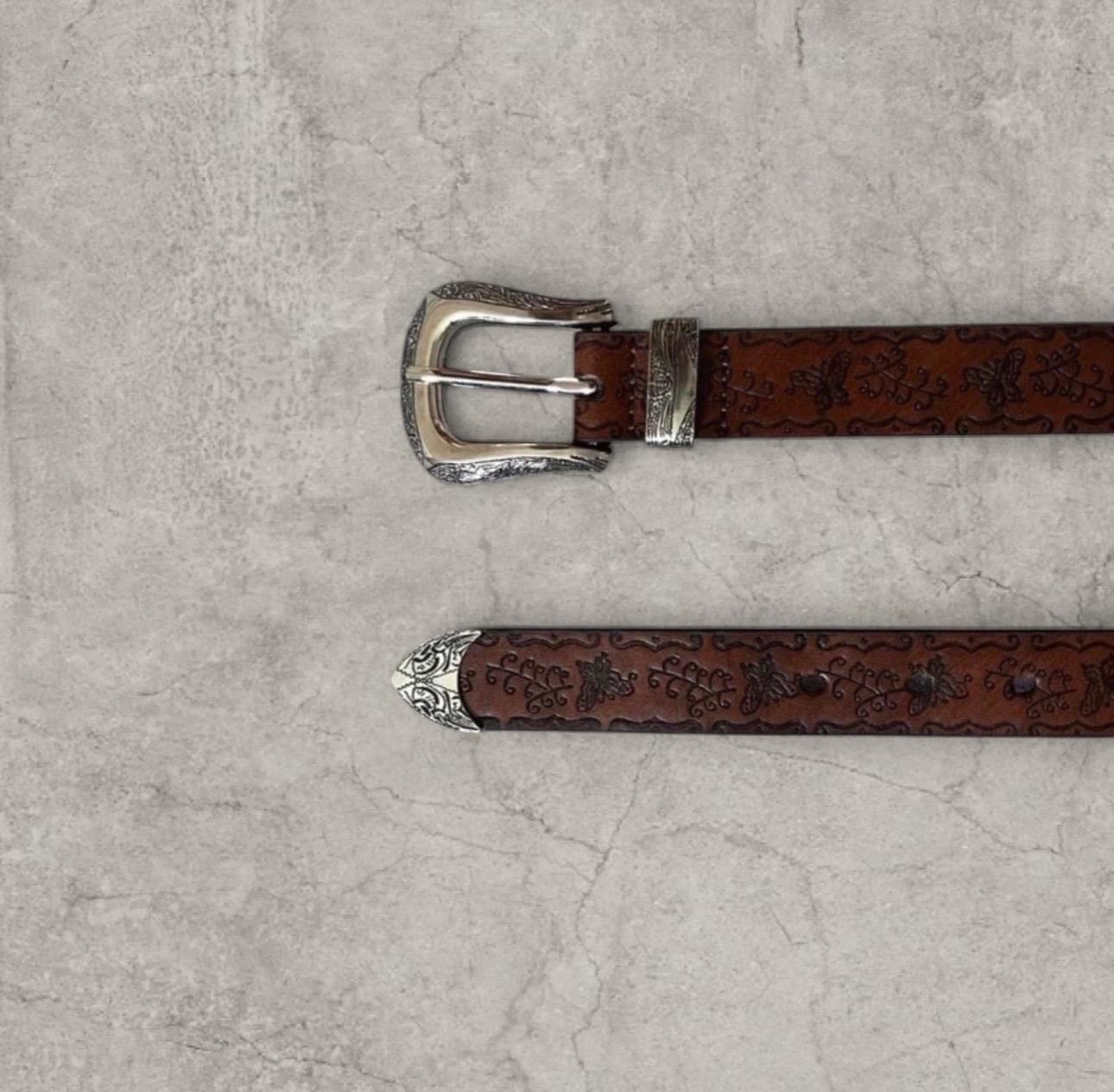 Vintage style faux leather western cowboy belt with silver trim in brown