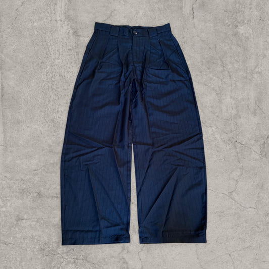 Front view of black wide-leg vintage style trousers with grey pinstripes laid flat