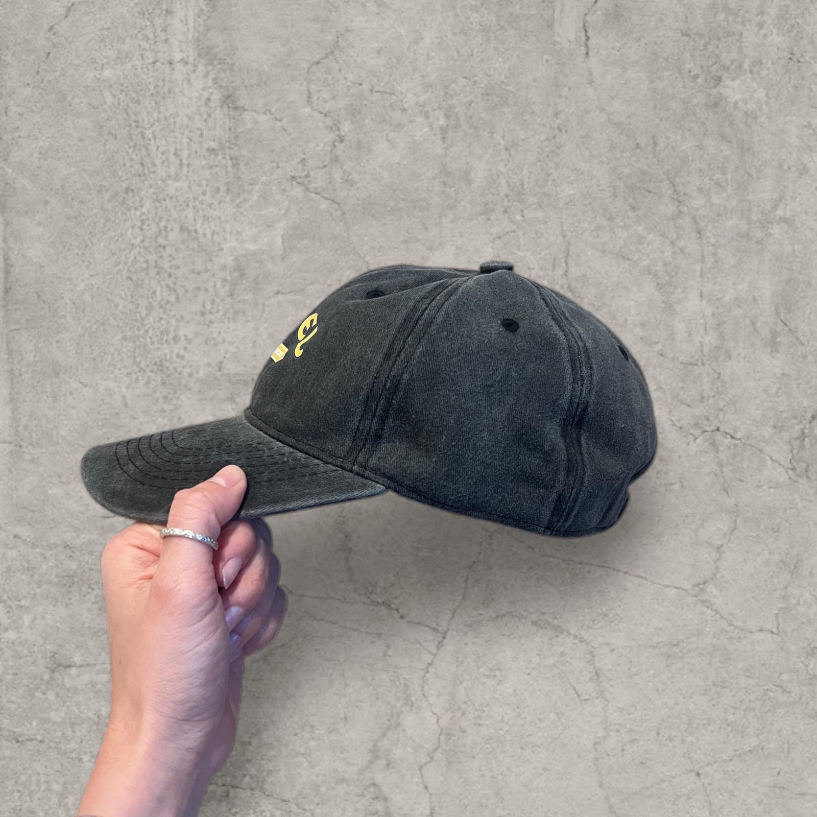 Vintage style baseball cap with yellow camel logo in black