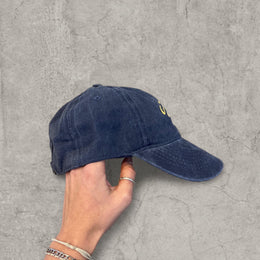 Vintage style baseball cap with yellow camel logo in navy blue