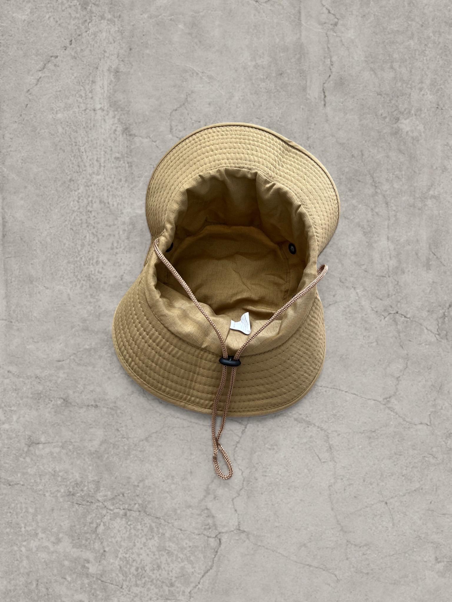 Vintage style Boonie jungle bucket hat with straps in beige. One size