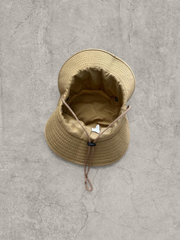 Vintage style Boonie jungle bucket hat with straps in beige. One size