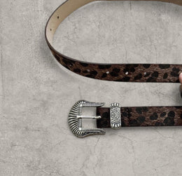 Vintage style faux leather western cowboy belt in brown leopard with silver trim. 103cm.