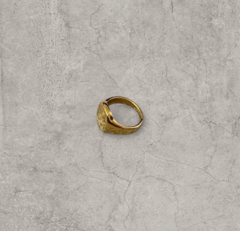 Cool vintage style gold colour stainless steel signet ring with made of magic engraving.