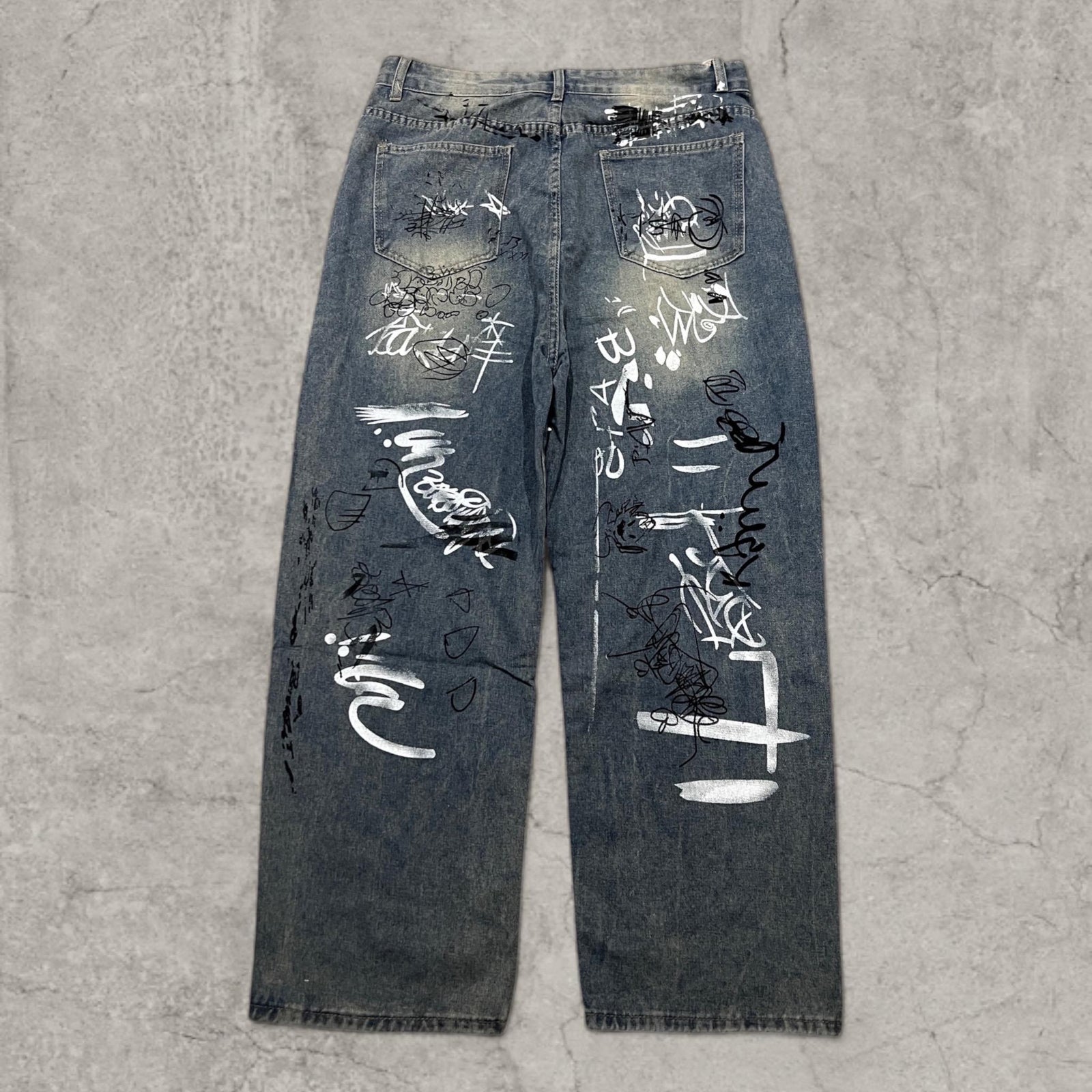 Insane baggy relaxed fit in washed  blue with graffiti white black print.