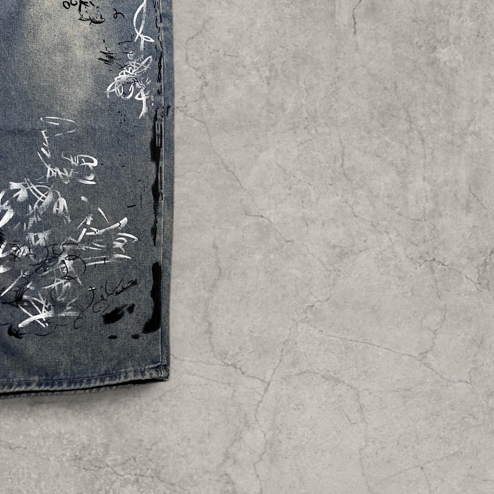 Insane baggy relaxed fit in washed  blue with graffiti white black print.