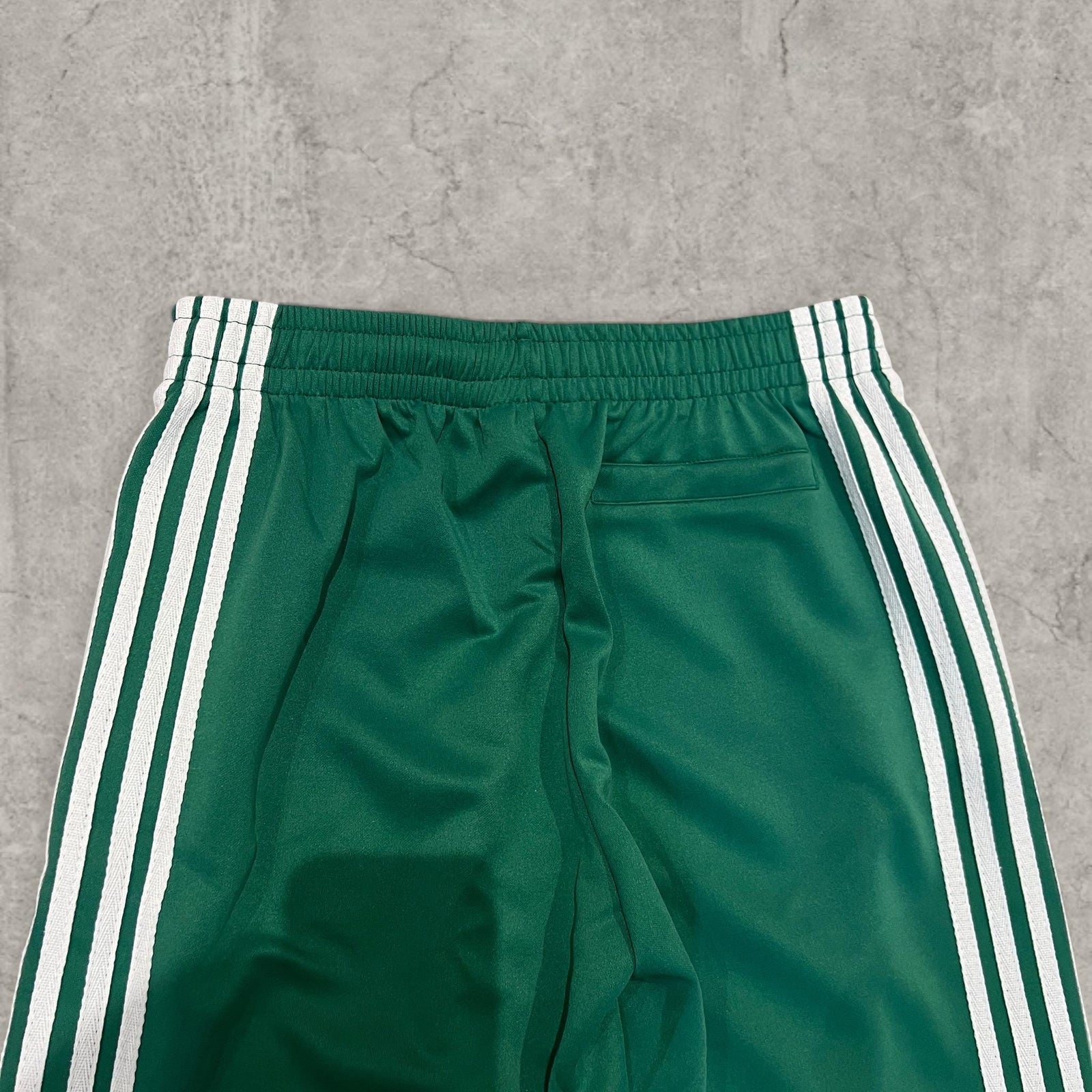 Insane baggy relaxed fit trousers in dark green with white stripes.