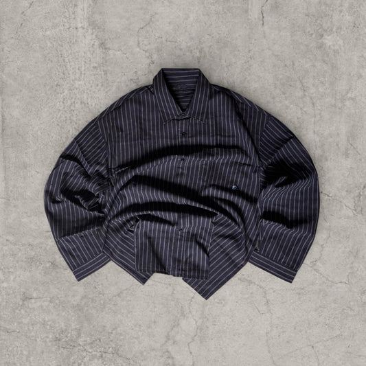 Dark brown and white striped tailored shirt laid flat showing collar and button front