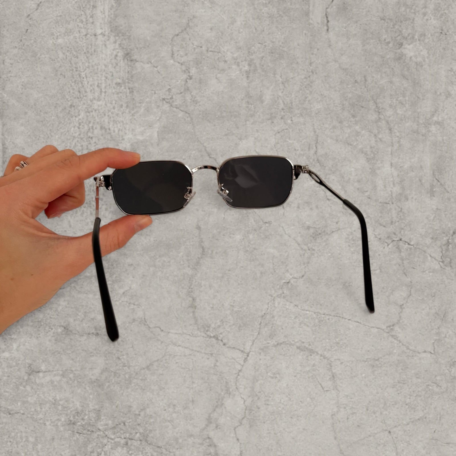 Insane UV400 sunglasses in silver grey with black lense. One size.