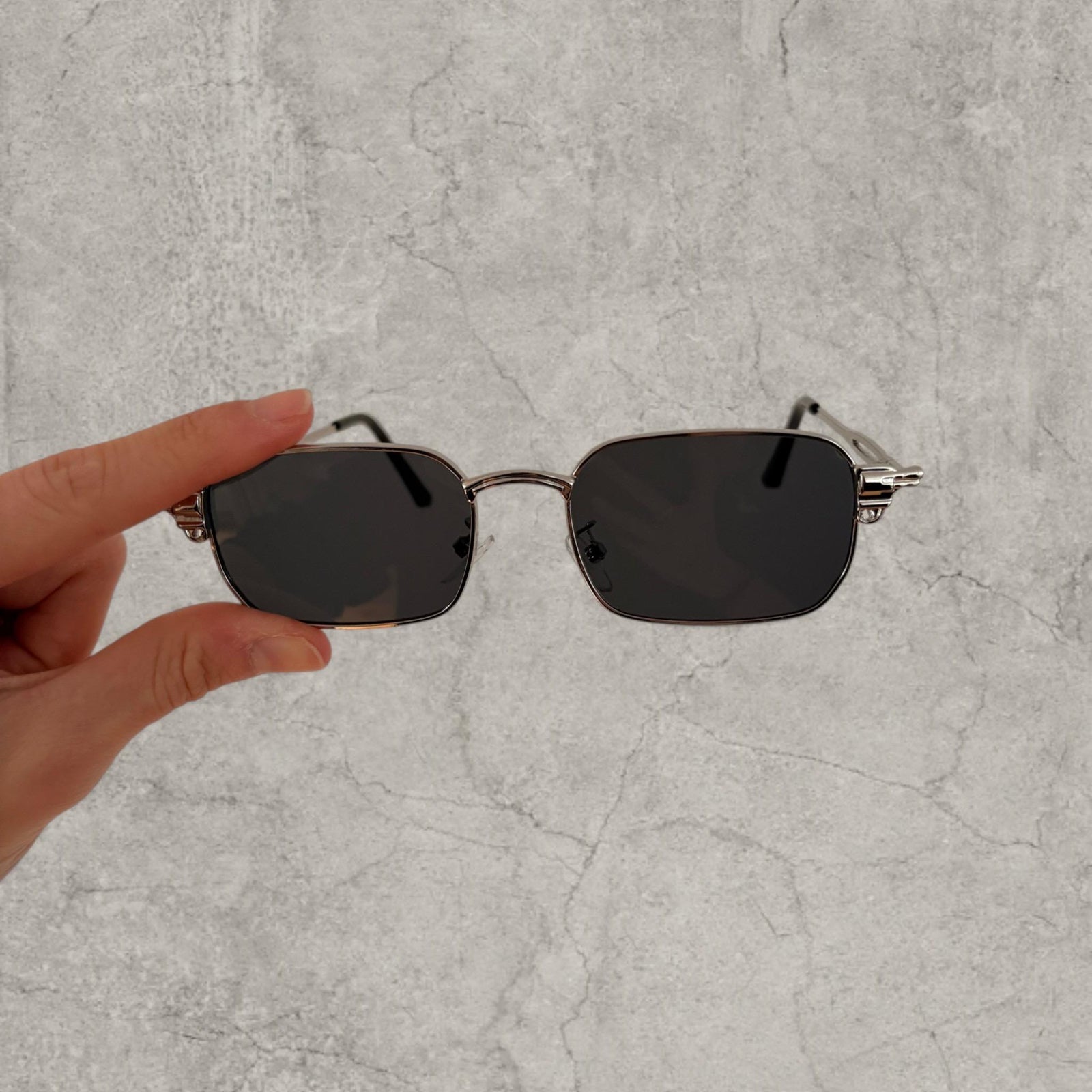 Insane UV400 sunglasses in silver grey with black lense. One size.