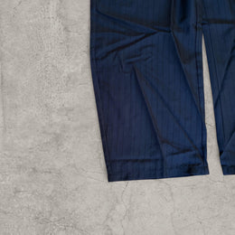 Vintage style baggy wide leg pinstriped tailored trousers in black with grey pinstripes.