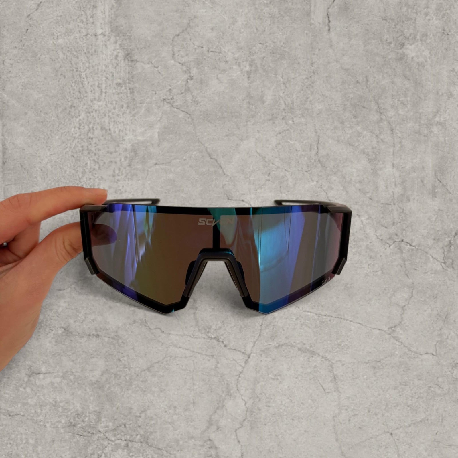 Insane sport sunglasses in black with blue purple reflective lenses. One size
