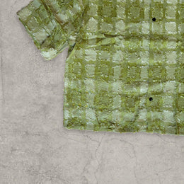 Cool boxy 90s style green checkered short sleeved shirt.