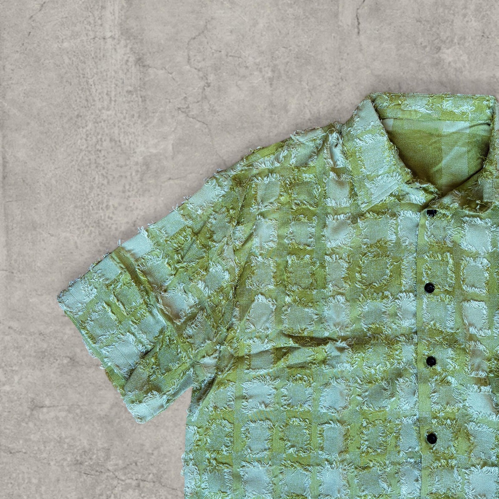 Cool boxy 90s style green checkered short sleeved shirt.