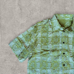 Cool boxy 90s style green checkered short sleeved shirt.