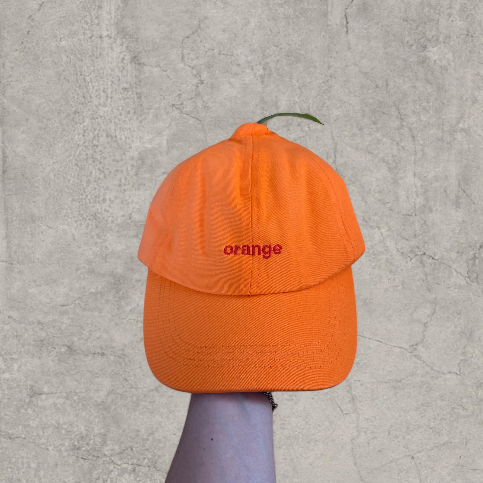 Vintage style baseball cap in orange with orange embroidered logo