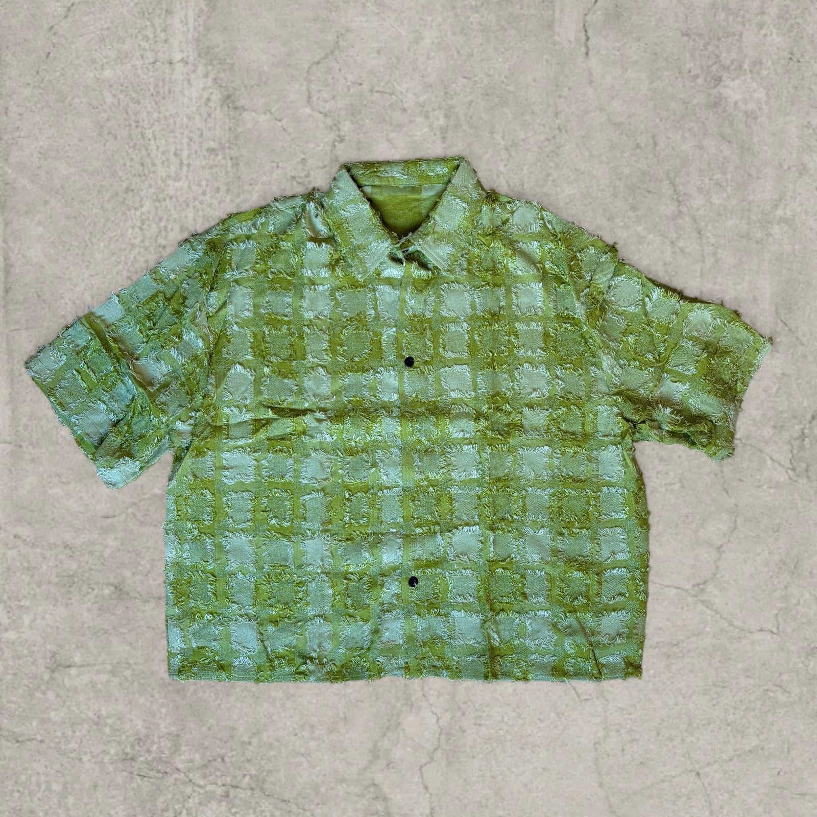Cool boxy 90s style green checkered short sleeved shirt.