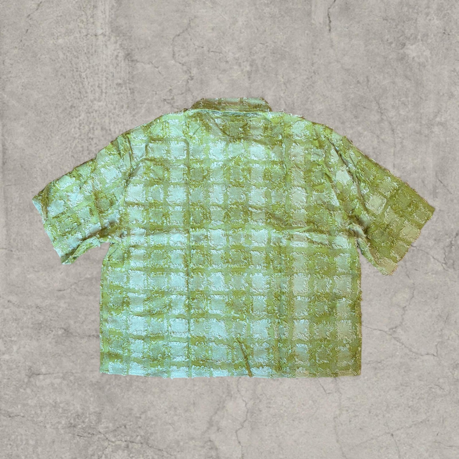 Cool boxy 90s style green checkered short sleeved shirt.