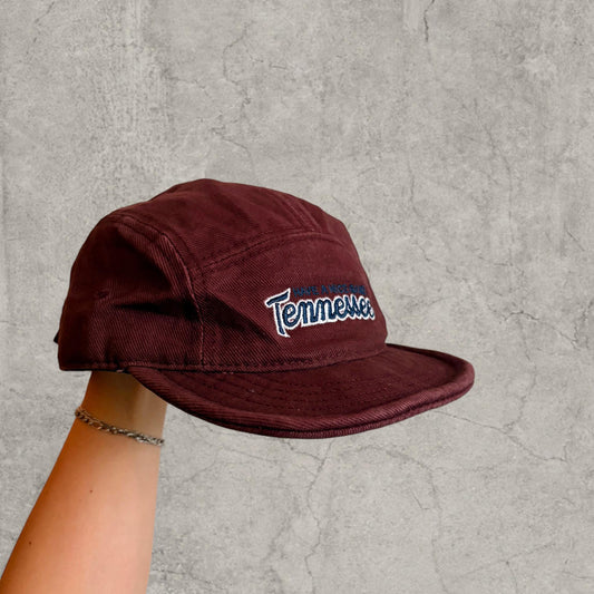 Burgundy red vintage style baseball cap with black and white Tennessee logo on front
