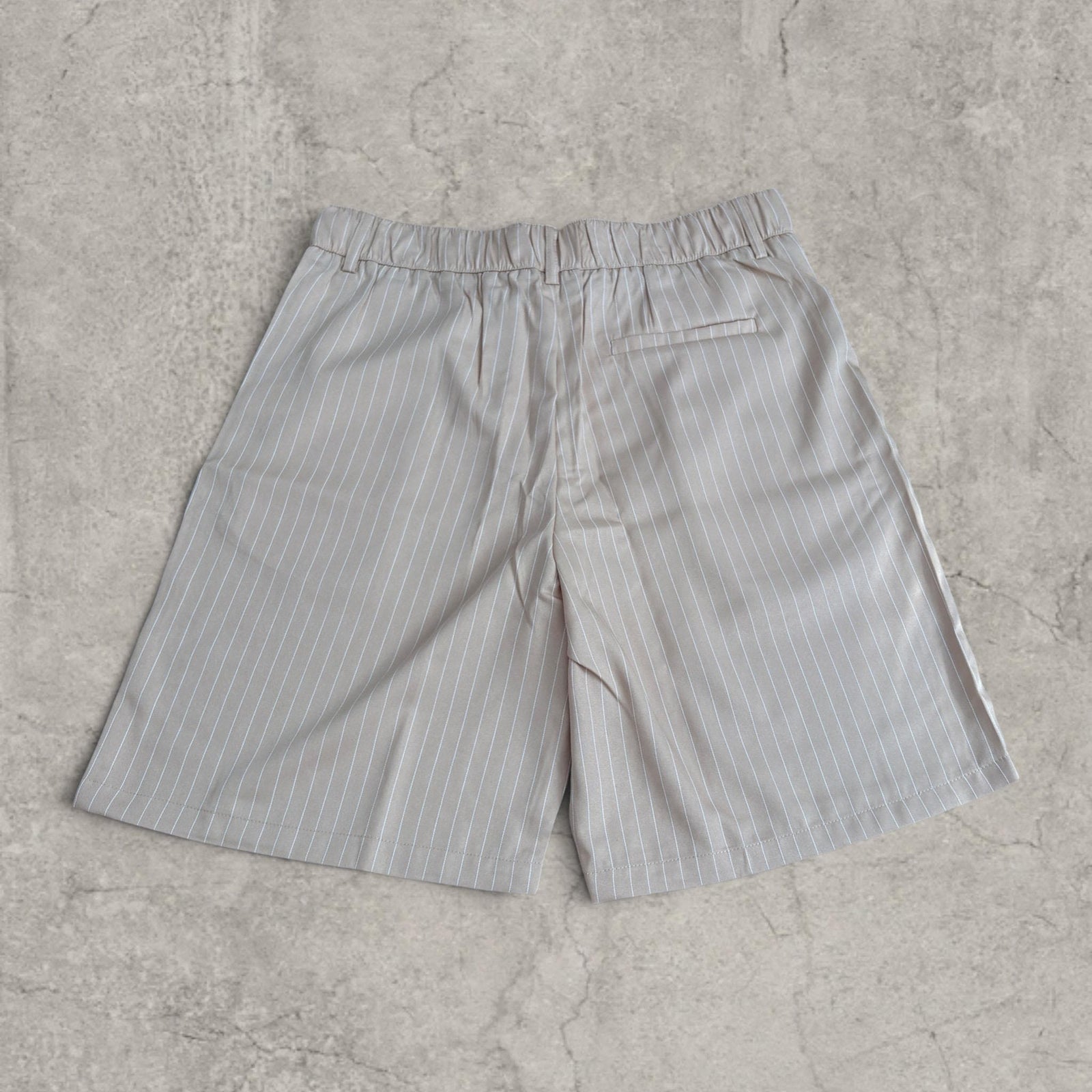 Insane baggy relaxed fit shorts in cream pinstripe with pleats.