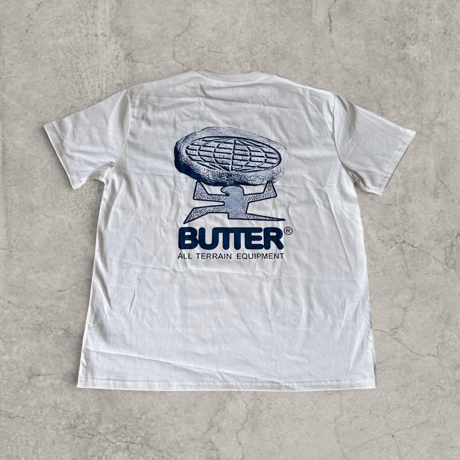 Butter vintage style T-shirt with front graphic in white with blue print.