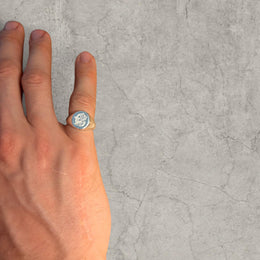 Cool vintage style silver colour stainless steel signet ring with engraved emblem.
