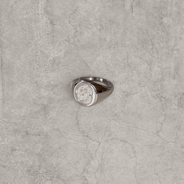 Cool vintage style silver colour stainless steel signet ring with engraved emblem.