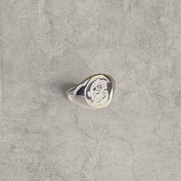 Cool vintage style silver colour stainless steel signet ring with engraved emblem.