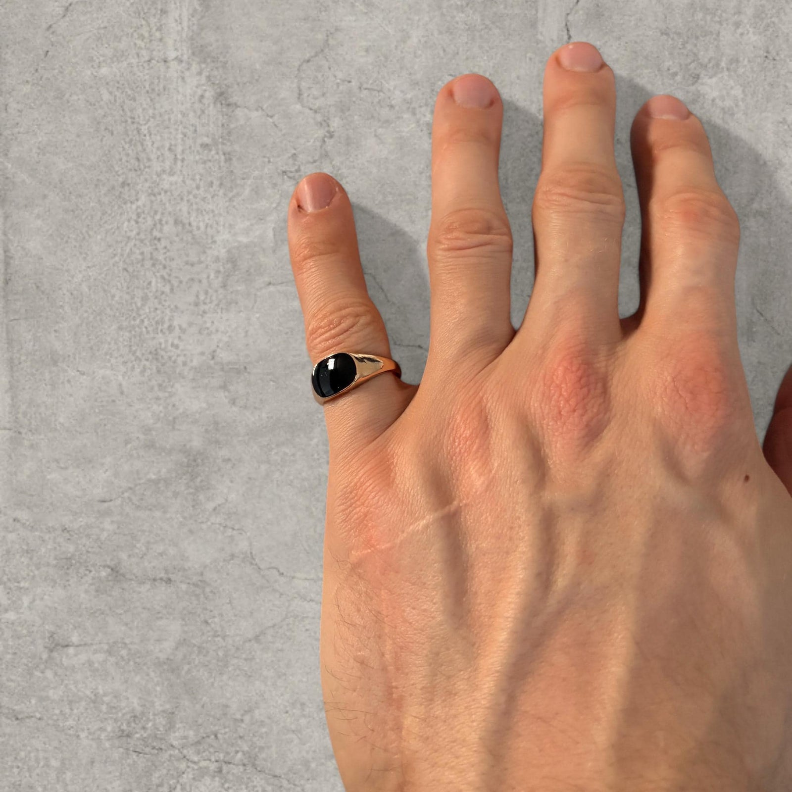 Stainless steel signet ring with black onyx gemstone in gold colour