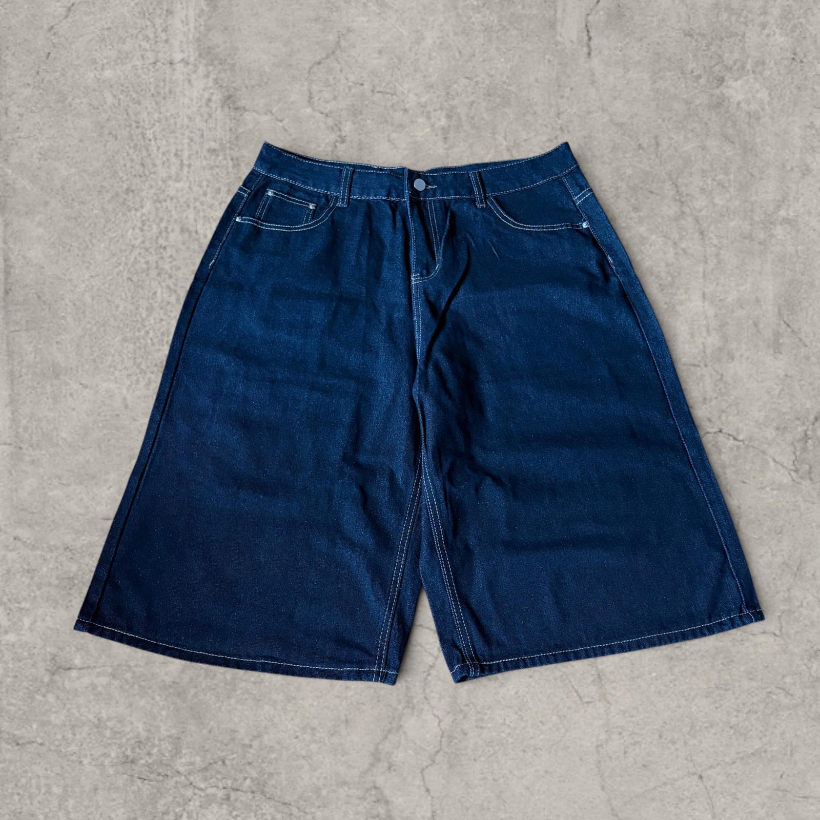 Retro 90s denim skater pocket jorts shorts in navy blue.