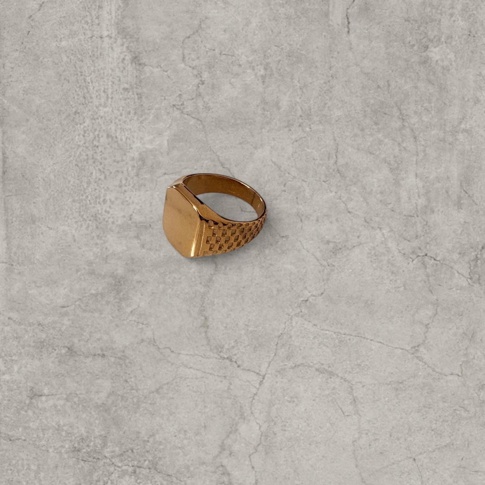 Cool vintage style gold colour stainless steel signet ring checkered detailing with square face.