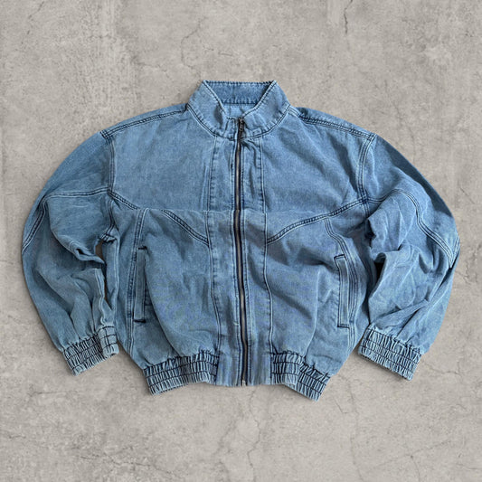 Front view of vintage style blue denim bomber jacket with collar and zip