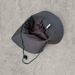 Vintage style Boonie jungle bucket hat with straps in khaki green. One size