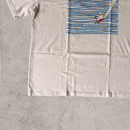 Surfing dog vintage style T-shirt with front graphic in white with blue print.