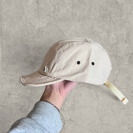 Outdoor hiking hat cap with triangular badge in cream
