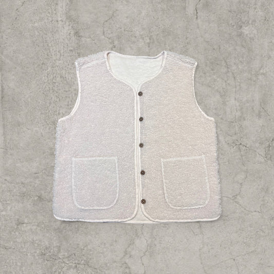 Cream sherpa style Gillette waistcoat with button-up front and two patch pockets laid flat